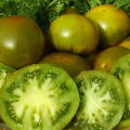 Kenmerken en beschrijving van het tomatenras Smaragdgroene appel, de opbrengst
