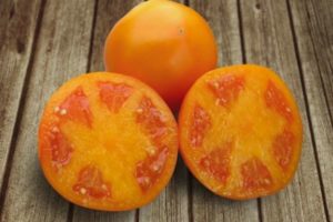 Beskrivning av Aisan-tomatsorten och dess egenskaper