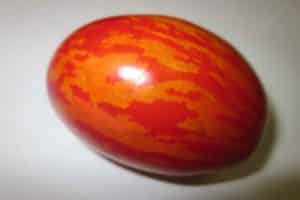 Egenskaper och beskrivning av tomatsorten påskägg